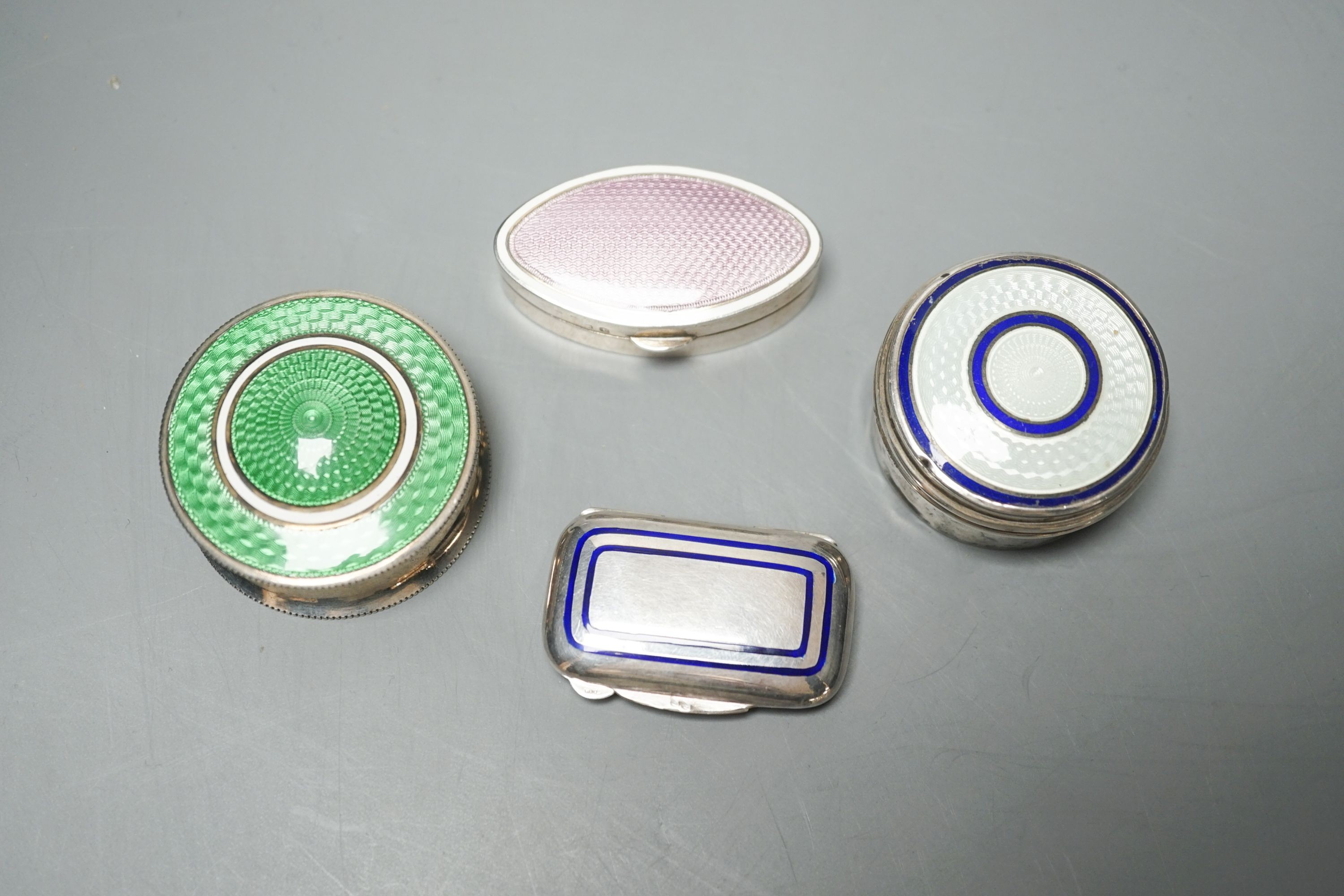 Three assorted early 20th century silver and enamel pill boxes, largest 49mm and a later similar Italian 925 box.